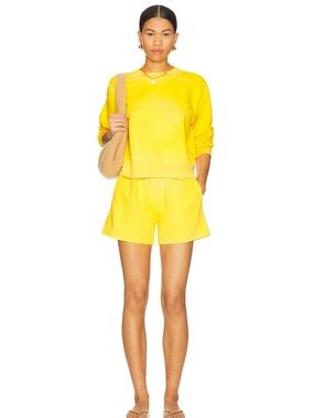 Cotton Citizen Sunny Yellow Elastic-Waist Shorts with Blue Brand Tag